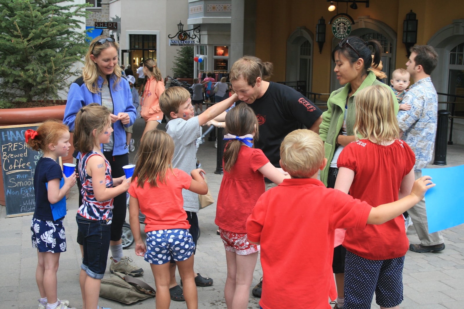 Image of children getting temporary tattoos at Vail's July 4th festivities in Colorado