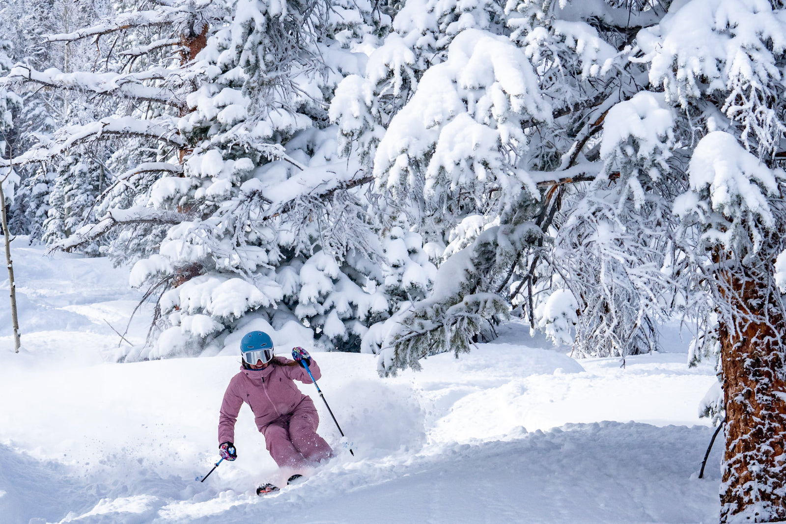 Image of a skier in pink at Aspen Snowmass in Colorado