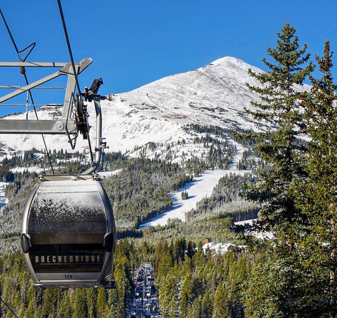 Image of the BreckConnect Gondola going up the snowy mountain in Breckenridge, Colorado