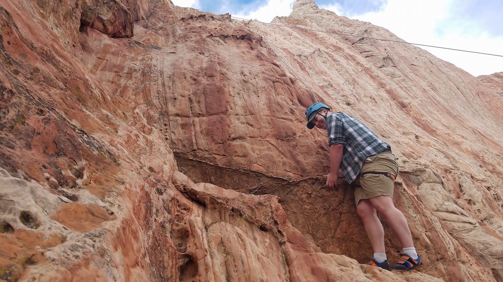 Image of a person rock climbing with the Colorado Climbing Company