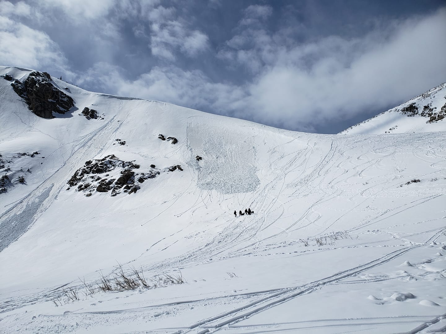 Image of people trekking through the snow with the Colorado Climbing Company