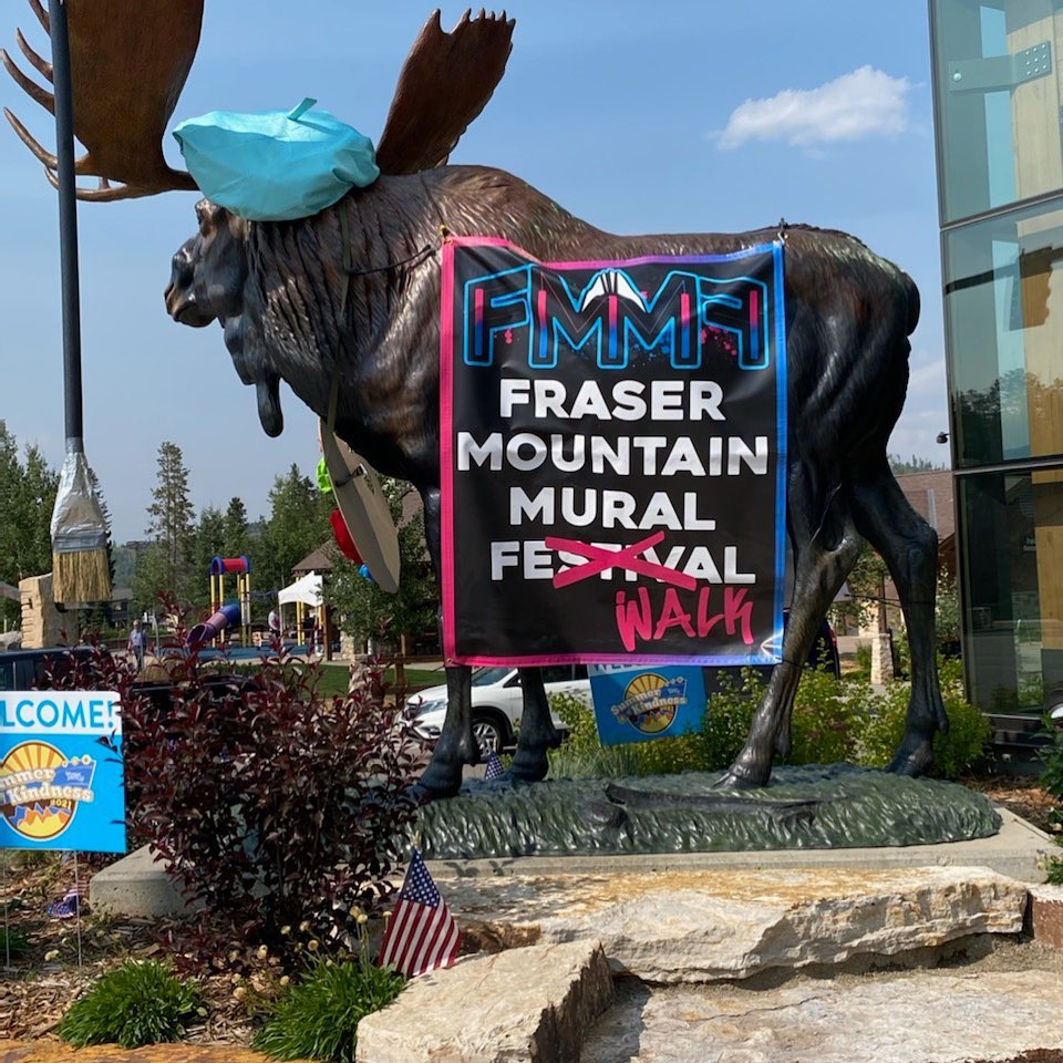 Image of a moose statue with a sign for the Fraser Mountain Mural Festival in Colorado