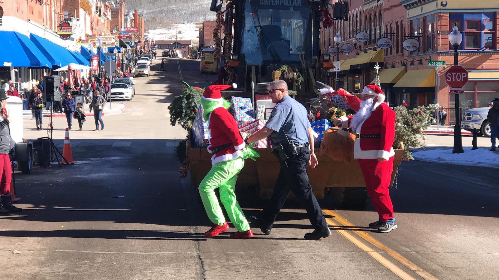 Image of the grinch being arrested while santa watches at Gold Camp Christmas Weekend in Cripple Creek, Colorado