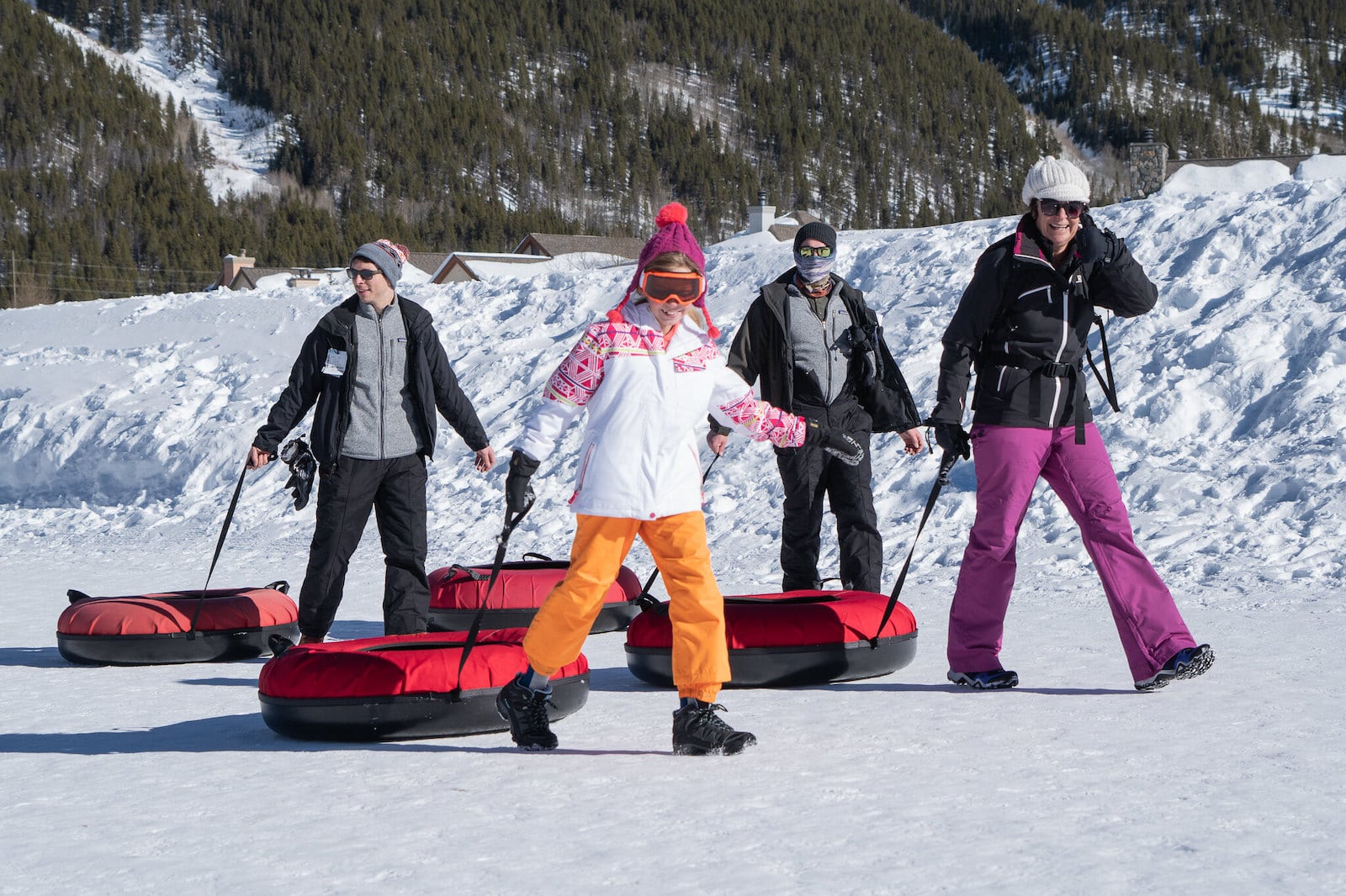 Image of people pulling snow tubes in Copper Mountain, Colorado