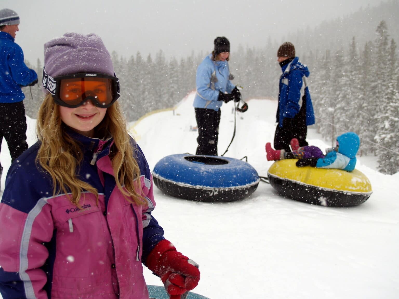 Which snow tubing hills are near what Colorado towns?