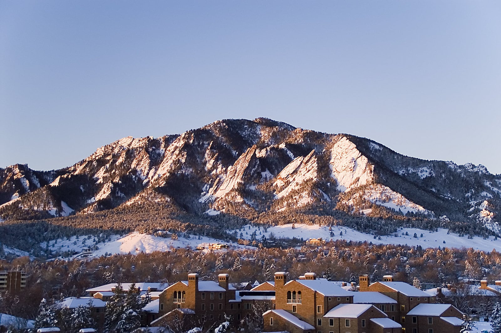 Image of the snow covered Flatirons