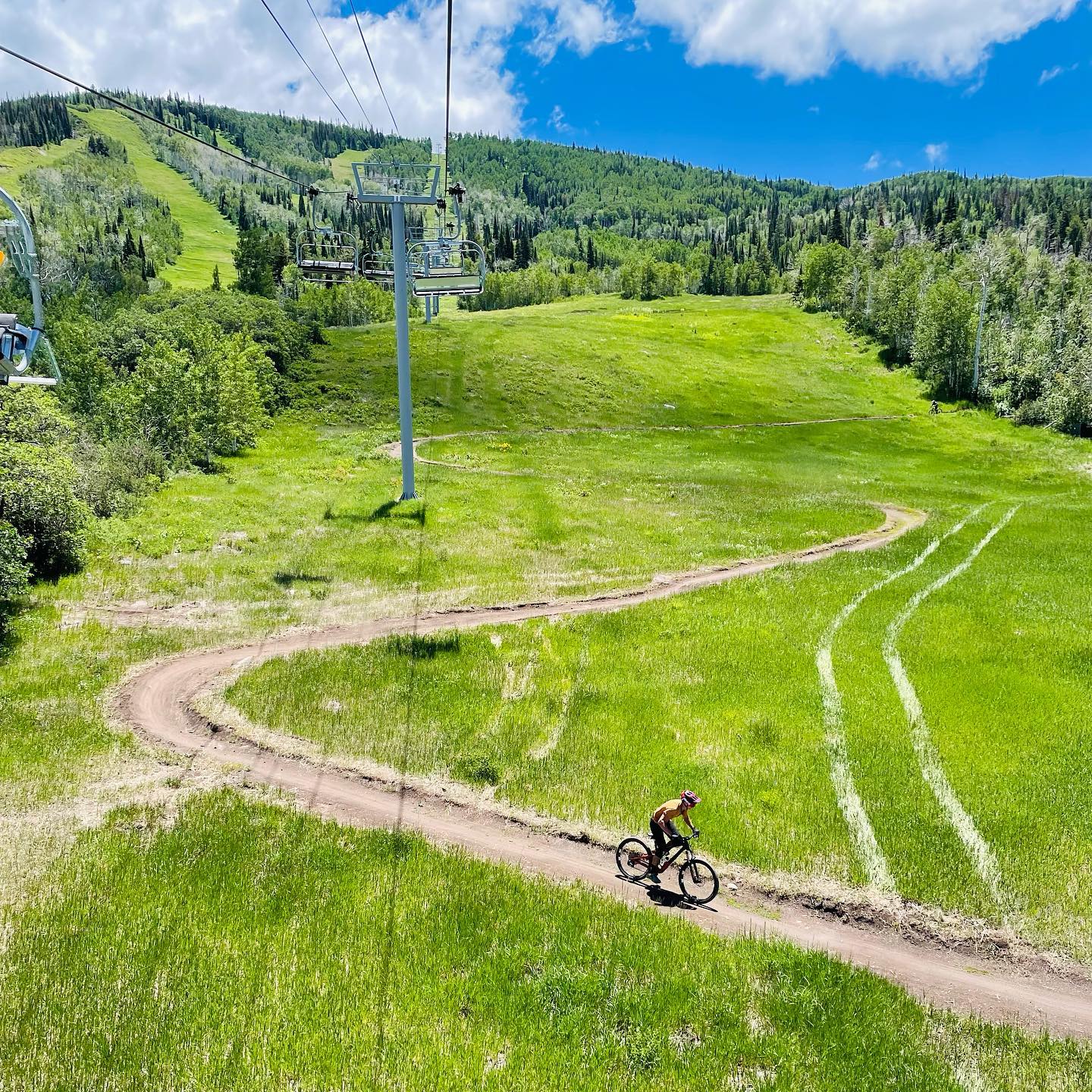 Image of a biker going under a chairlift at Powderhorn Resort in Colorado