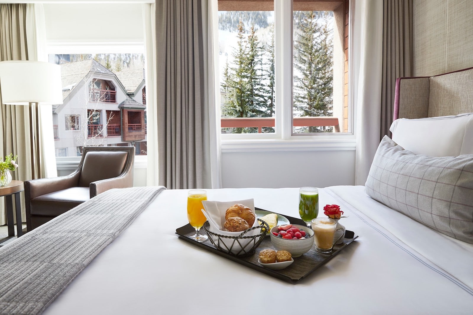 Image of breakfast on a bed at the The Little Nell in Aspen, Colorado