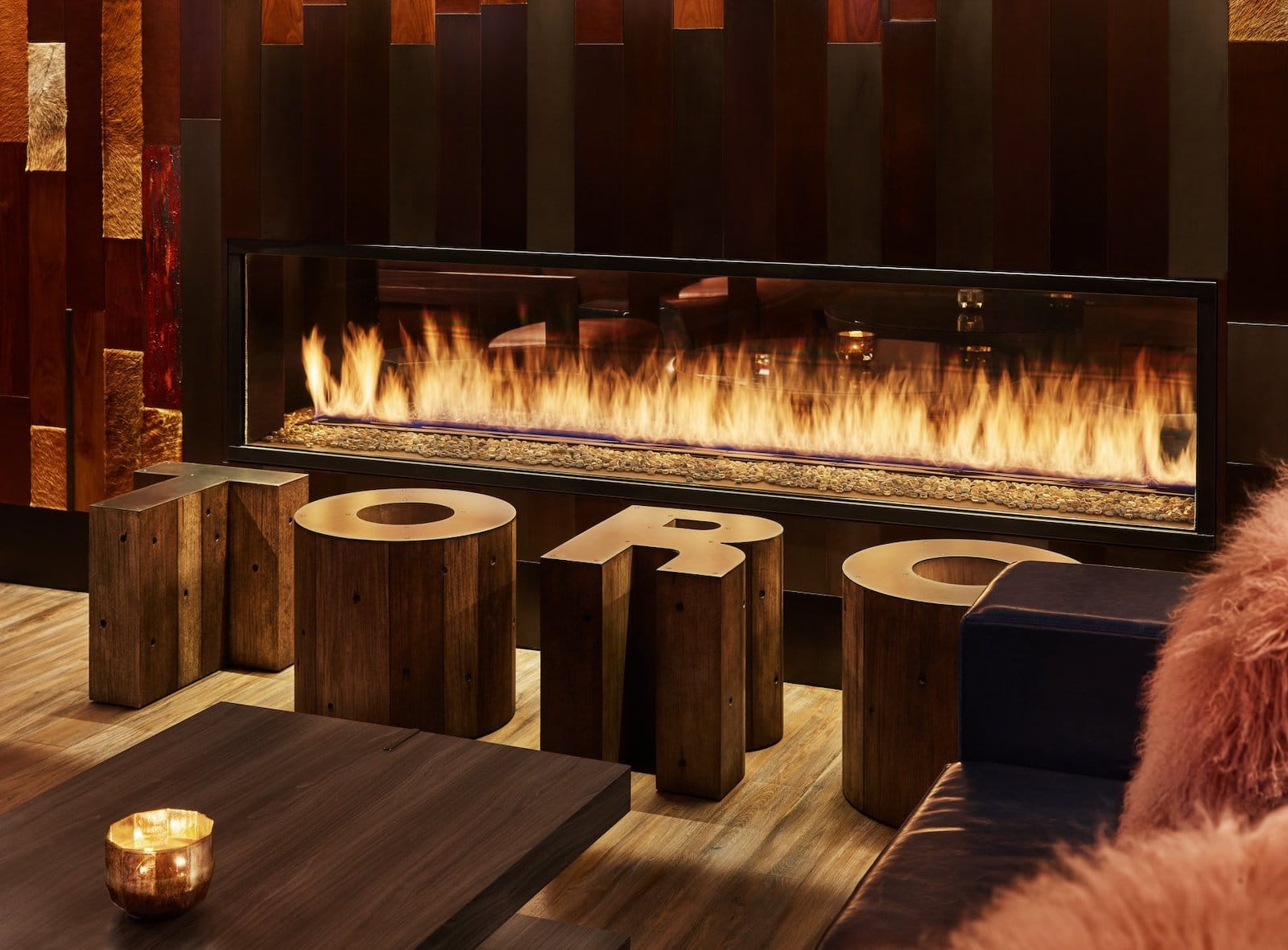 Image of a fireplace with TORO in front of it at Viceroy in Snowmass, CO