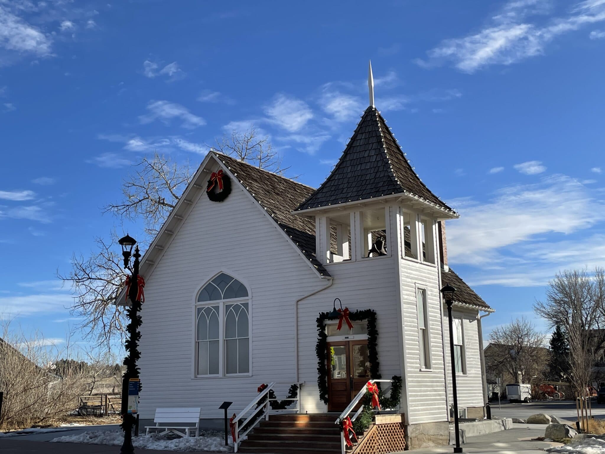 historic white church in downtown parker