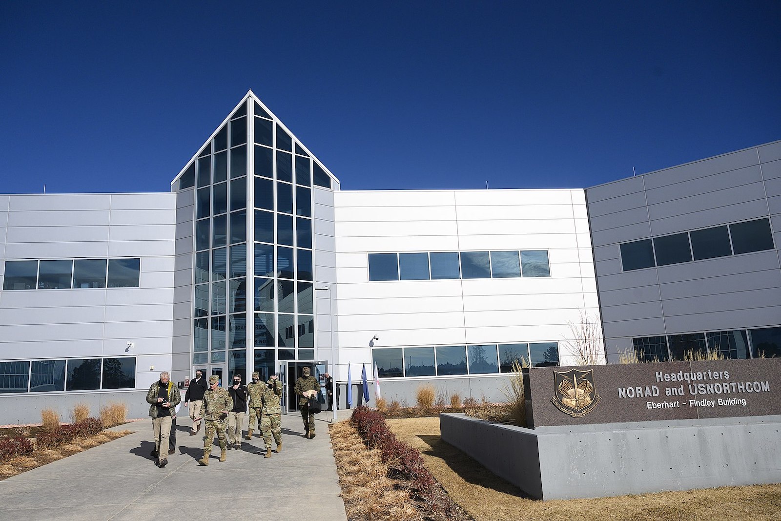 Image of acting Defense Secretary Chris Miller departs the headquarters of North American Aerospace Defense Command and United States Northern Command with NORAD-NORTHCOM Commander Air Force Gen. Glen VanHerck at Peterson Air Force Base in Colorado Springs