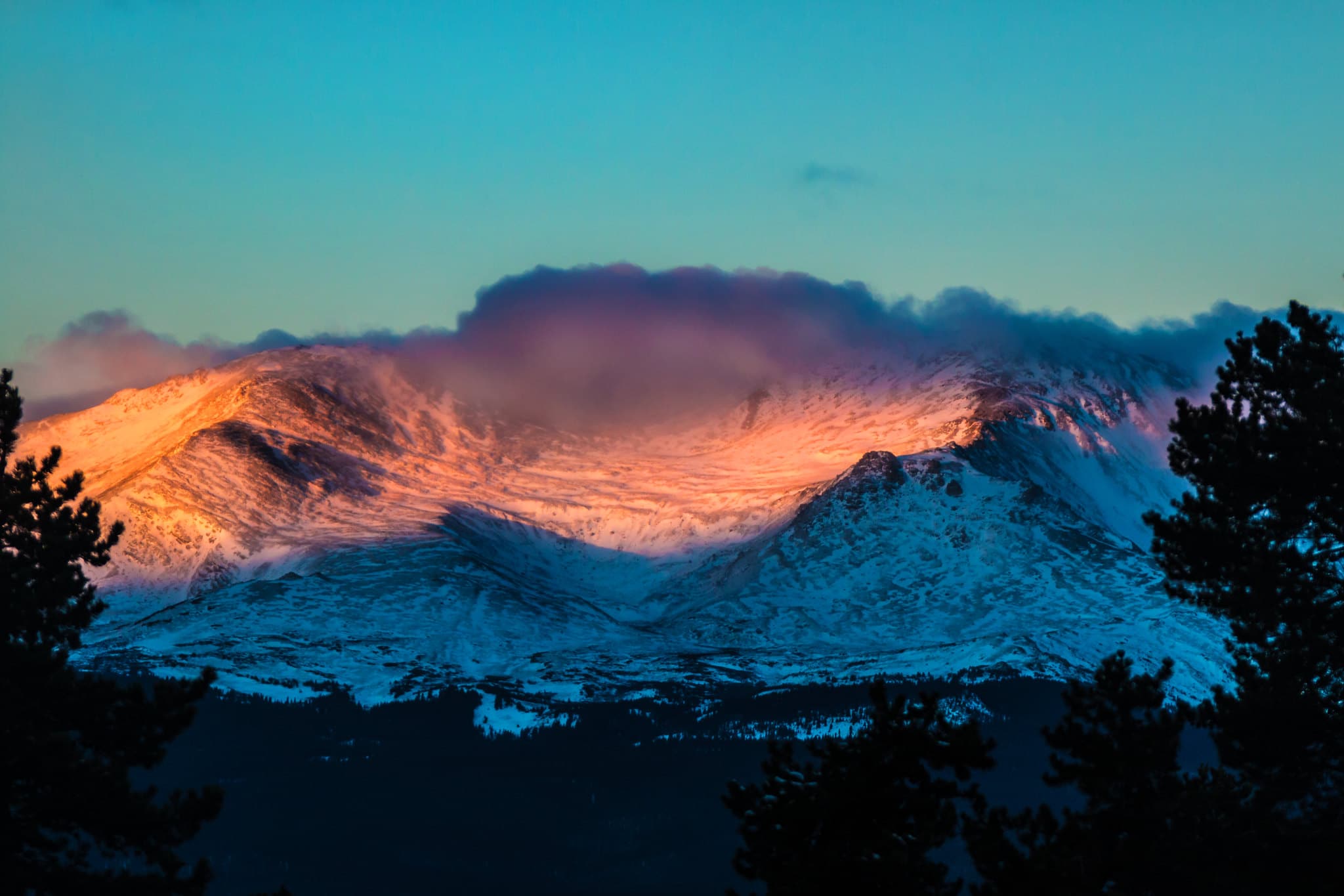 sun rising over mount massive