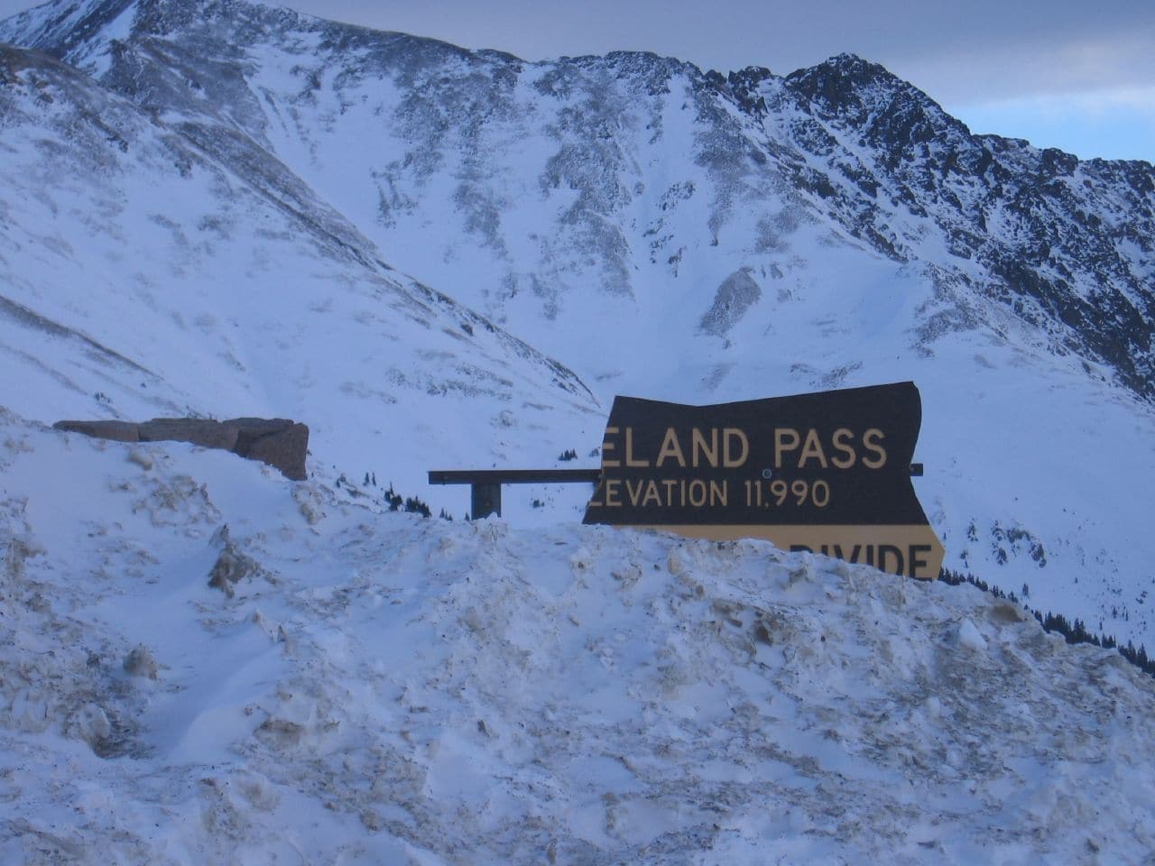 Avalanche over broken Loveland Pass sign