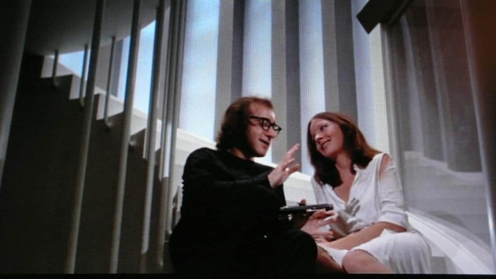 Man and woman sit on the stairs in Woody Allen's film "Sleeper"