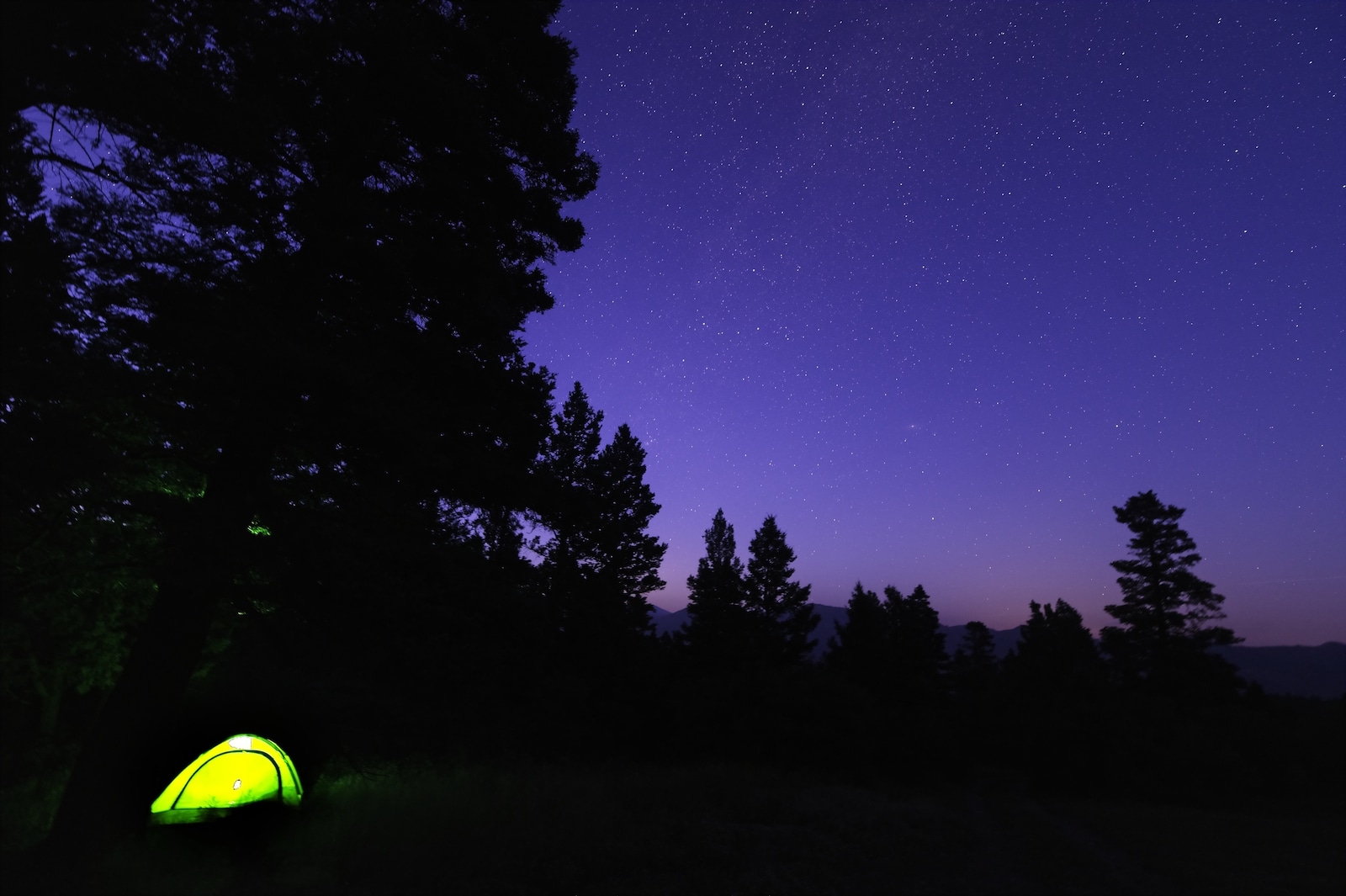 Yellow Light with Starry Sky in Colorado