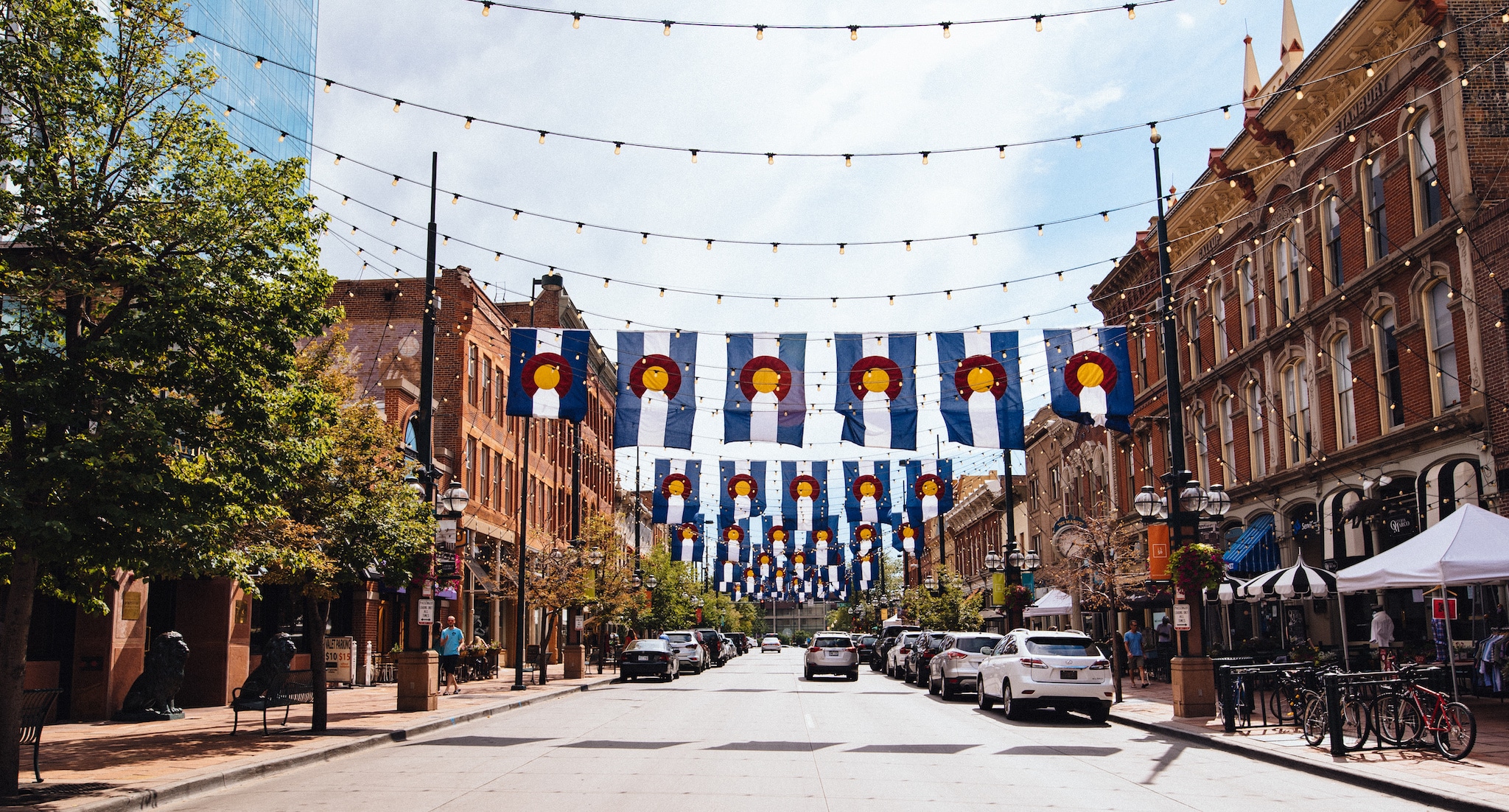 Colorado flags hang above Larimer street in Denver.