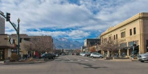 Downtown Colorado Springs on Kiowa Street with Pikes Peak in background