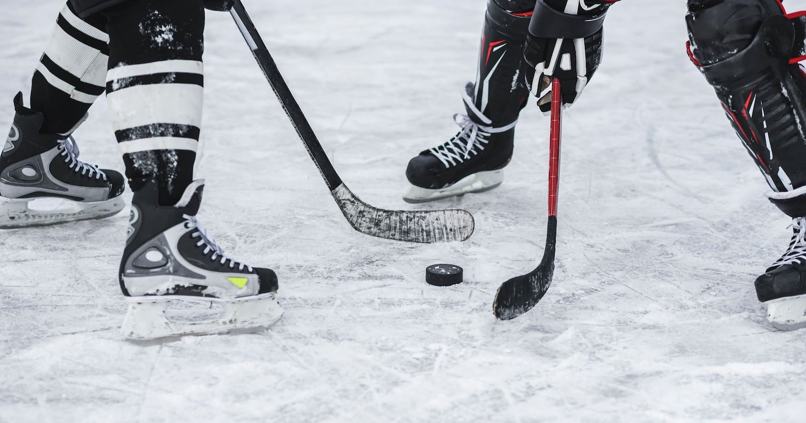 Image of people playing hockey at the Family Sports Ice Arena in Centenn