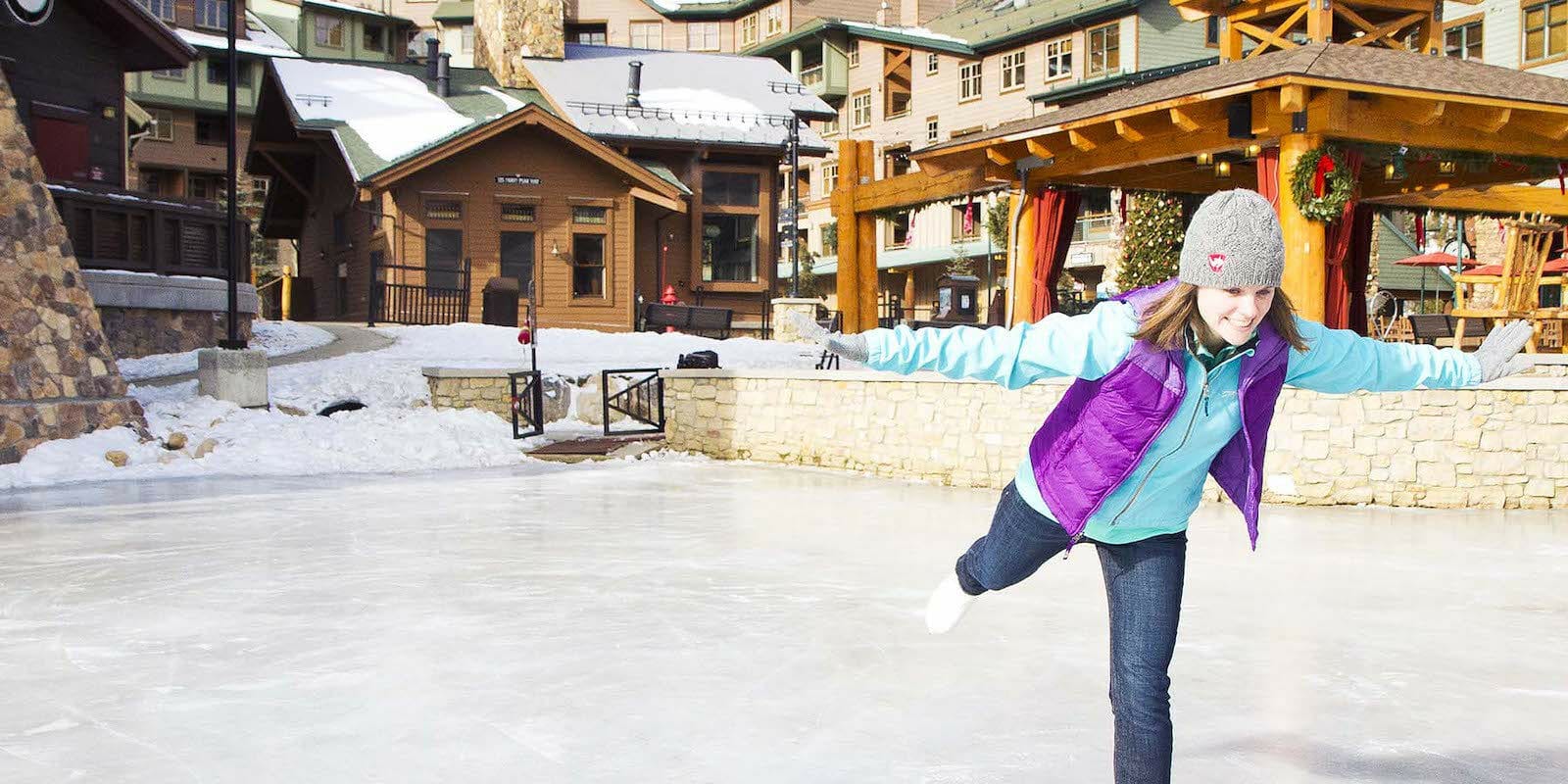 Image of a person skating t Winter Park Resort's ice rink in Colorado