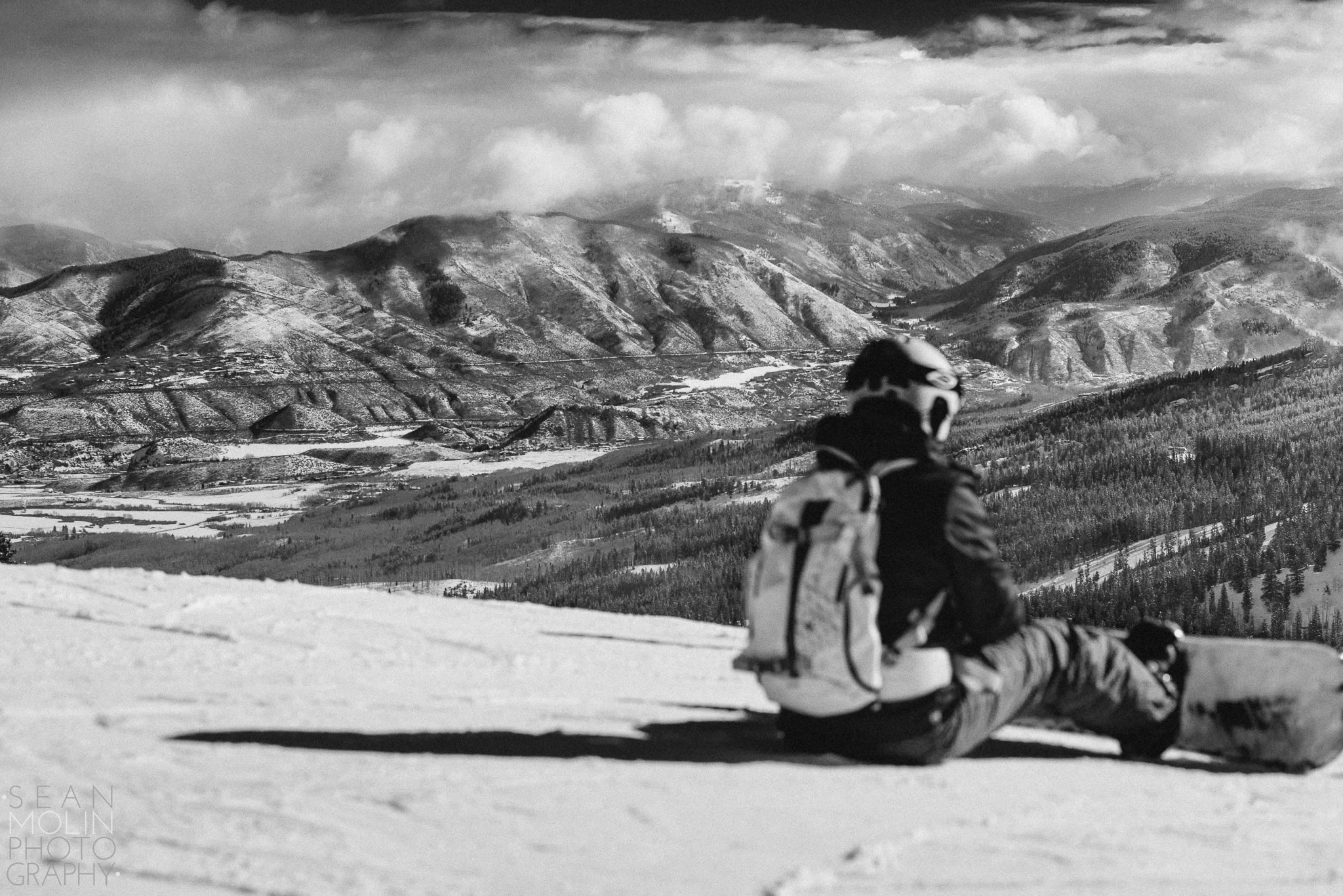 A snowboarder enjoy a beautiful winter day on top of Aspen Mountain.