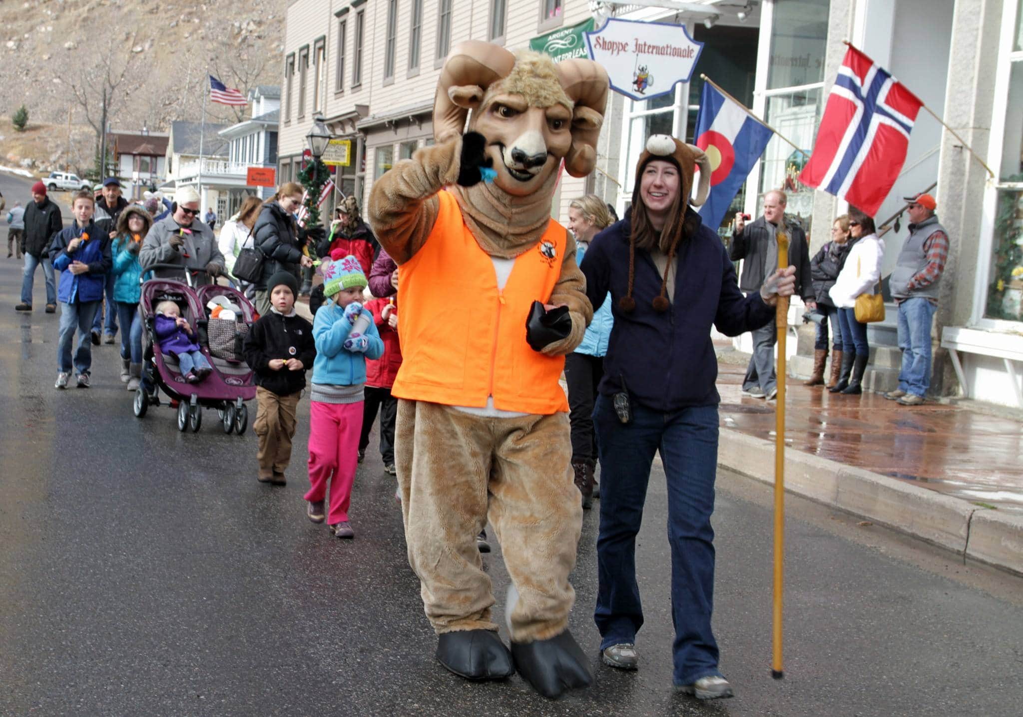 Parade with a mascot in front