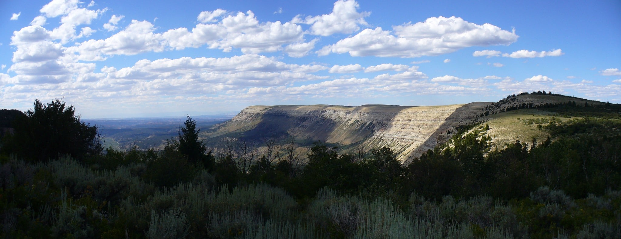 Cathedral Bluffs in the distance under a cloudy sky