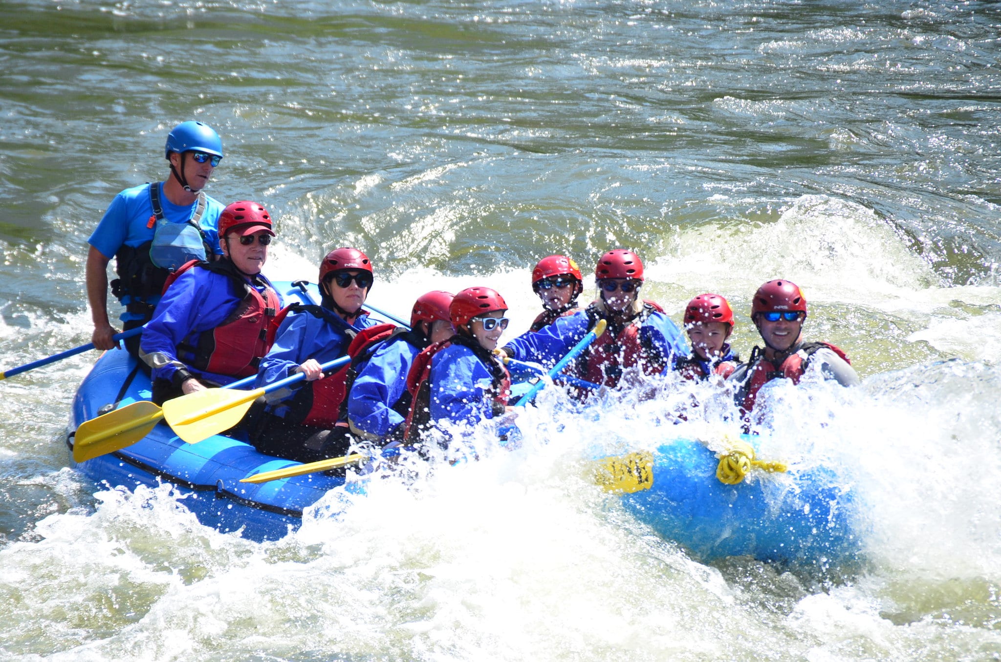 A rafting group enjoys small rapids on the Colorado River.