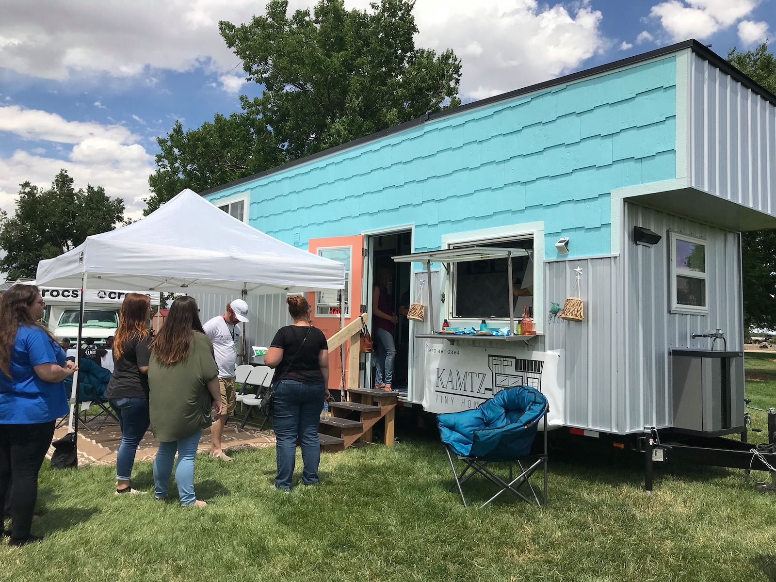 Image of people at the Kamtz Tiny Home tent at the Colorado Tiny House Festival in Colorado