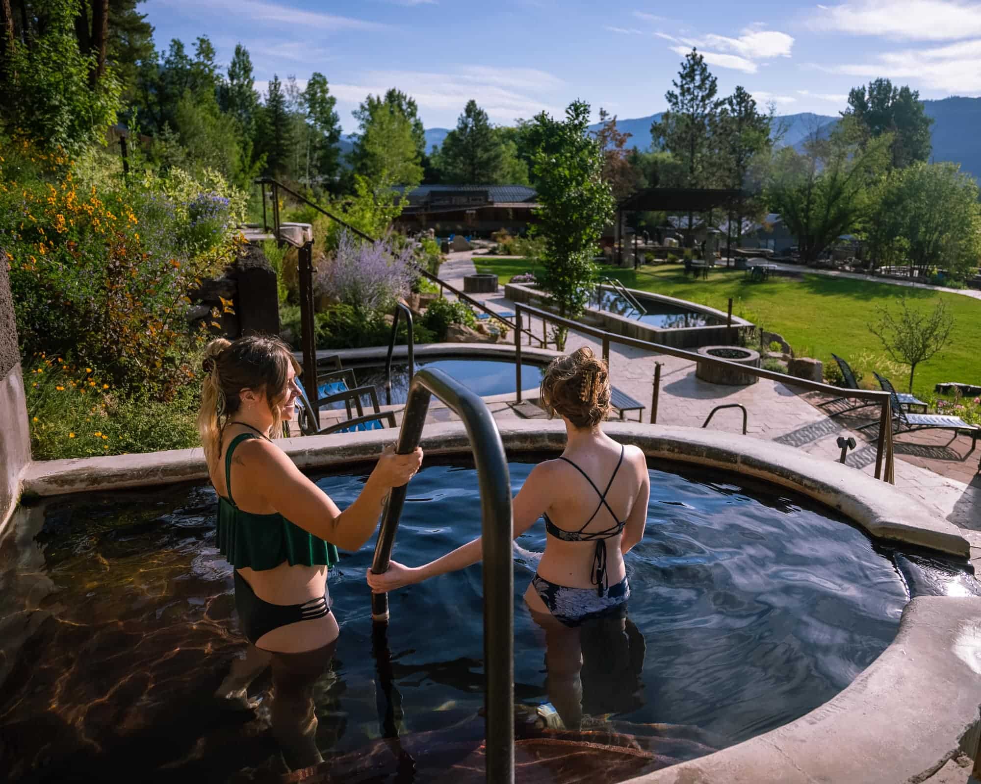 Two people in hot spring soaking tub