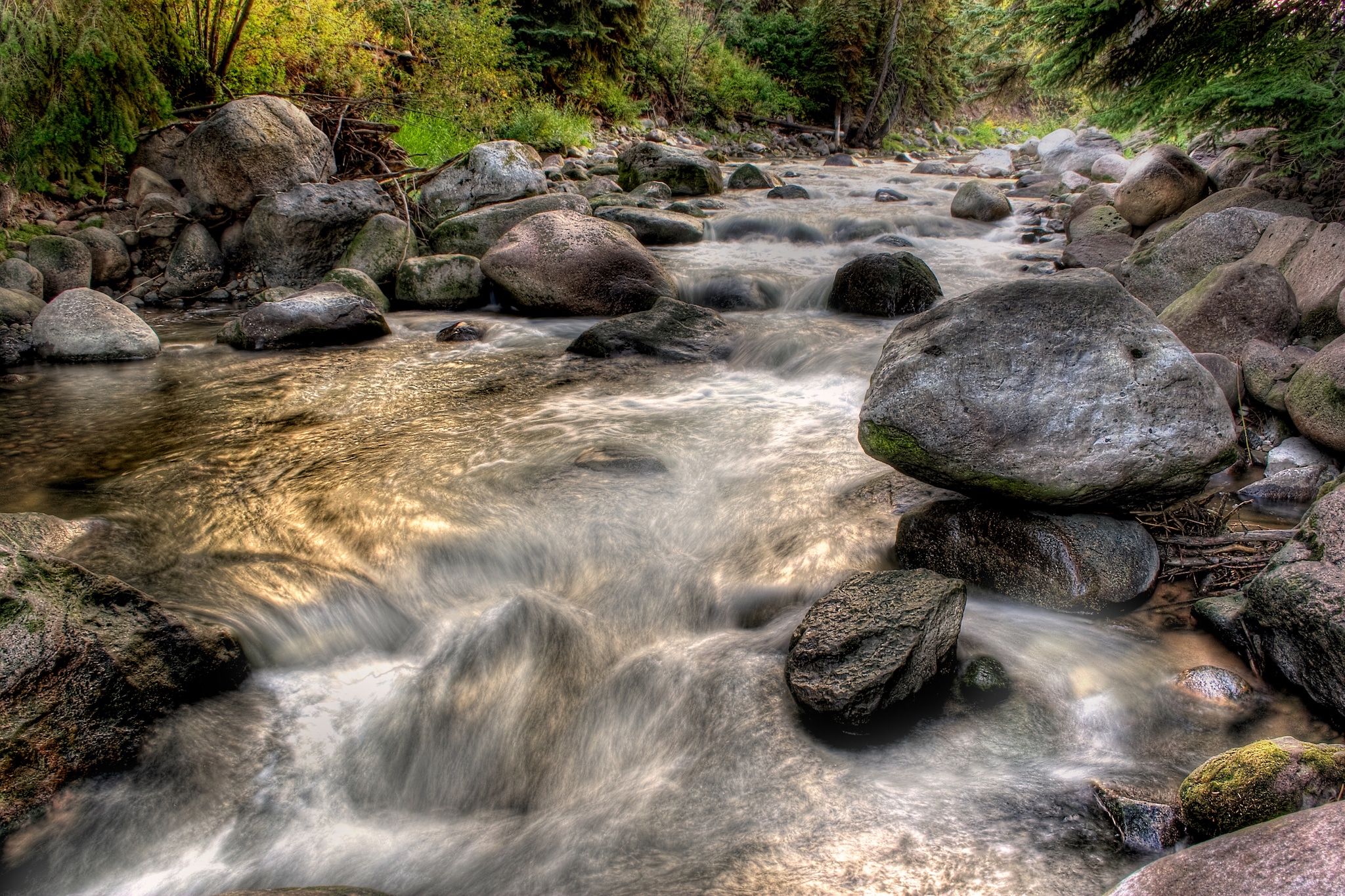 Gore creek flowing over a series of small cascades in the heart of the Colorado mountains.