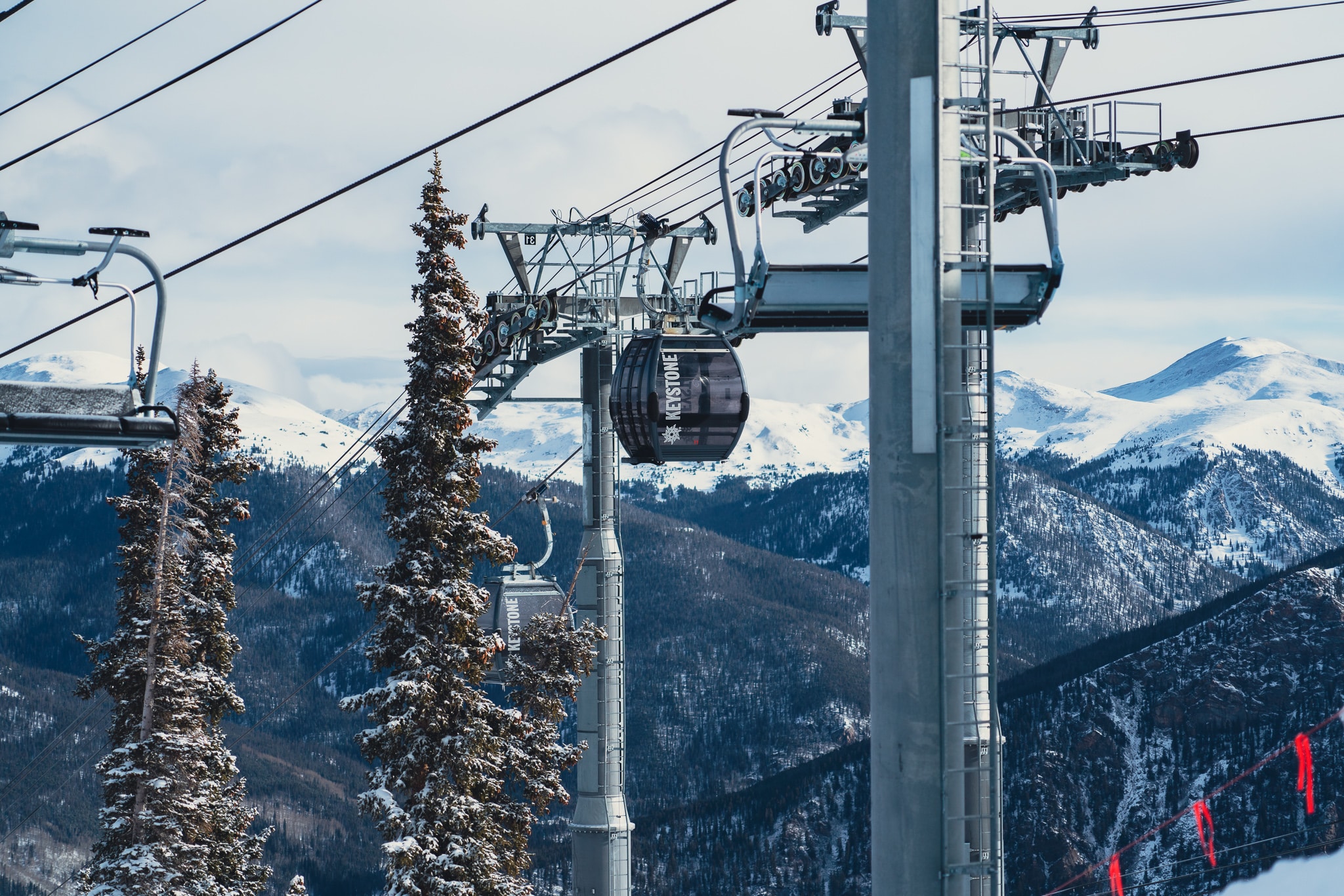 Gondola over snowy mountains at Keystone Resort