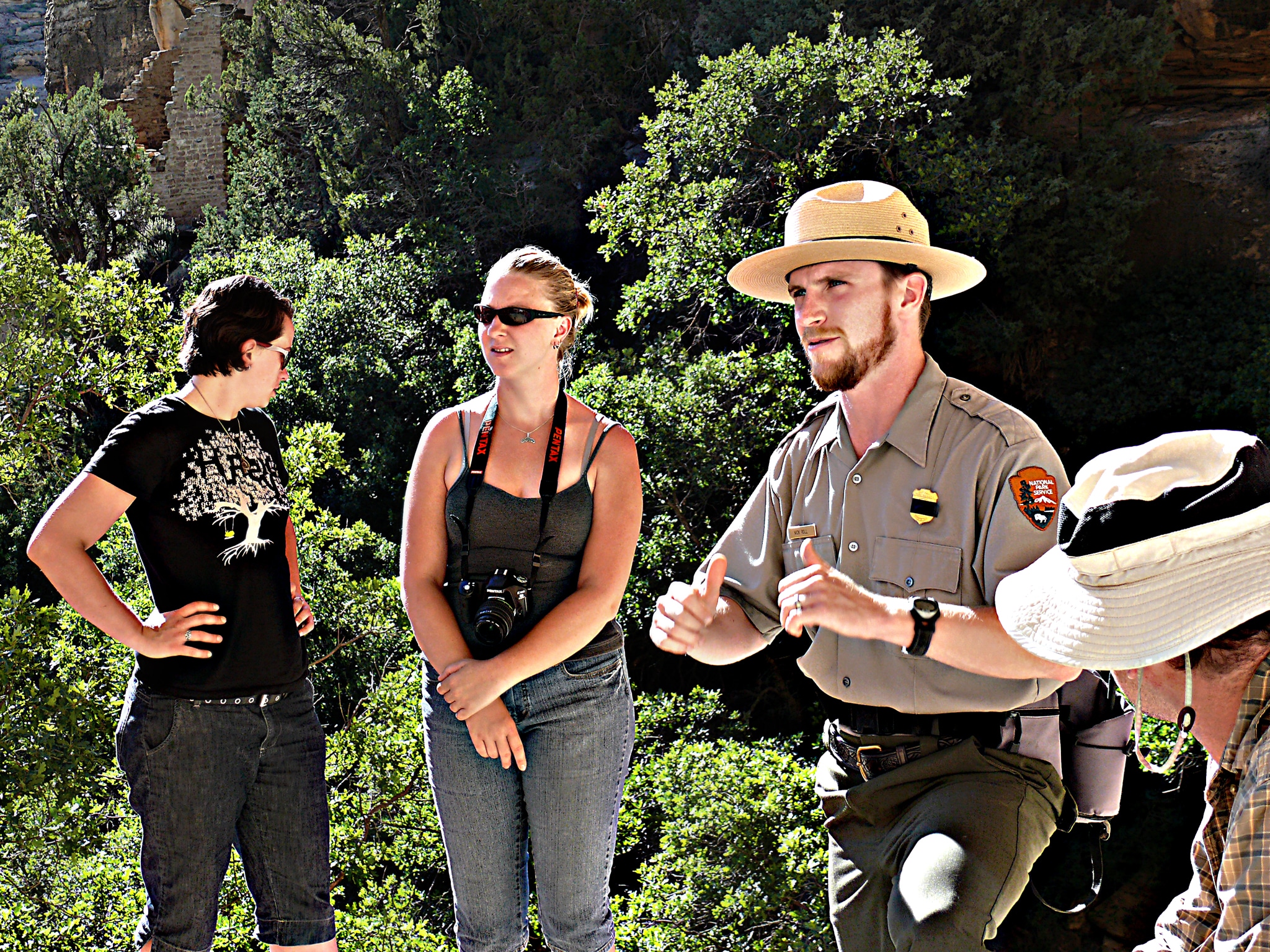 A park ranger at Mesa Verde National Park talks with a group of visitors.