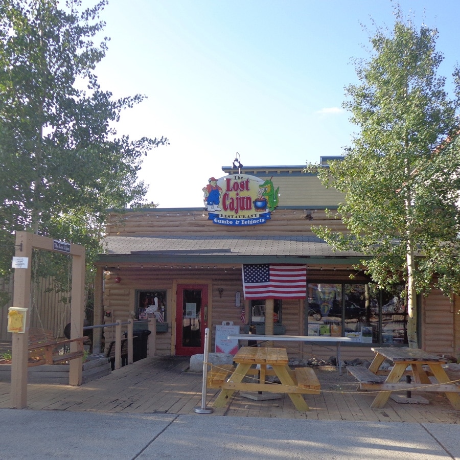 The Lost Cajun restaurant, red building with picnic tables