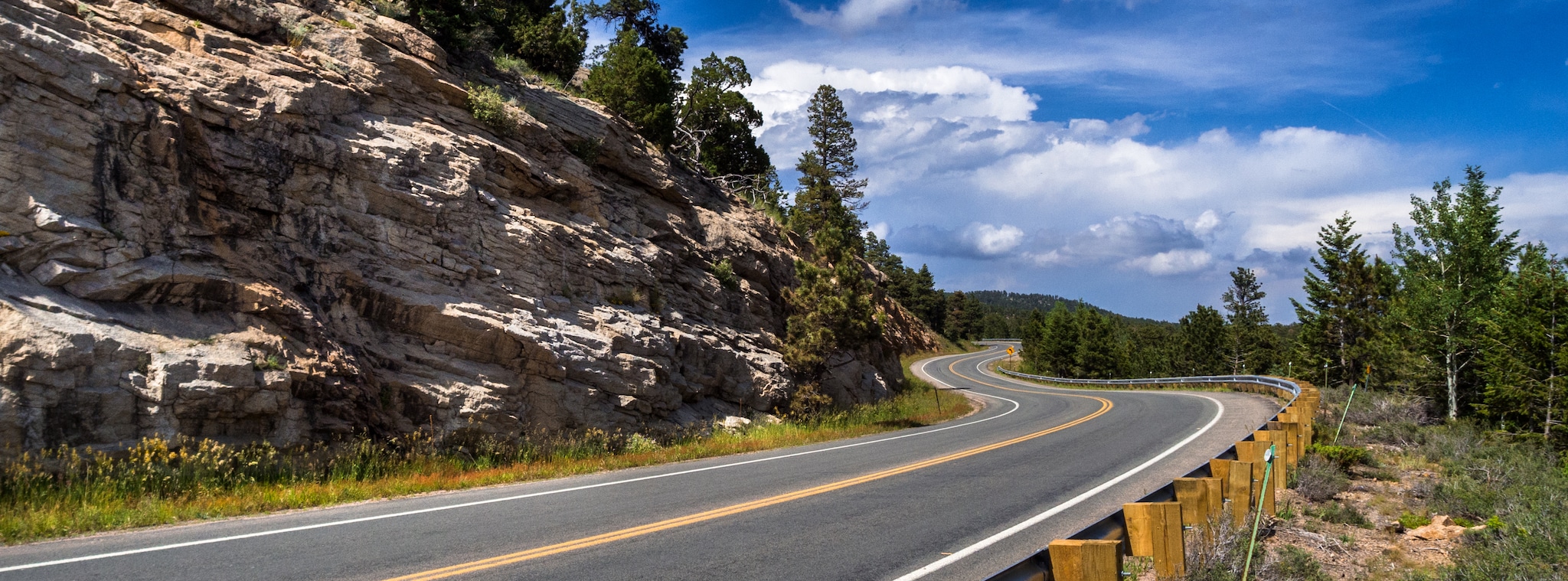 A look at the winding nature of the Peak-to-Peak Highway as it navigates rocky ridges.