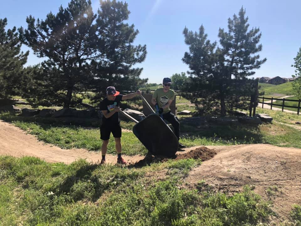 2 men digging dirt