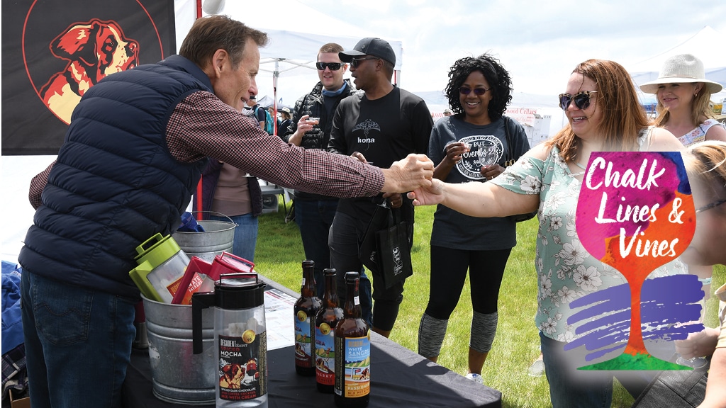 Image of people trying samples at Chalk Lines & Vines in Aurora, Colorado