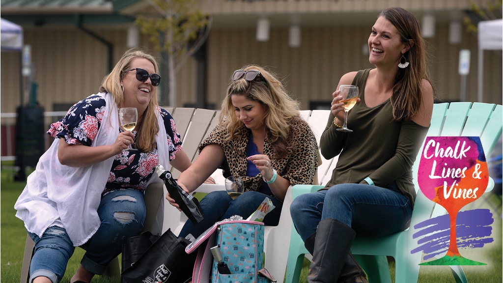 Image of people drinking wine at Chalk Lines & Vines in Aurora, Colorado