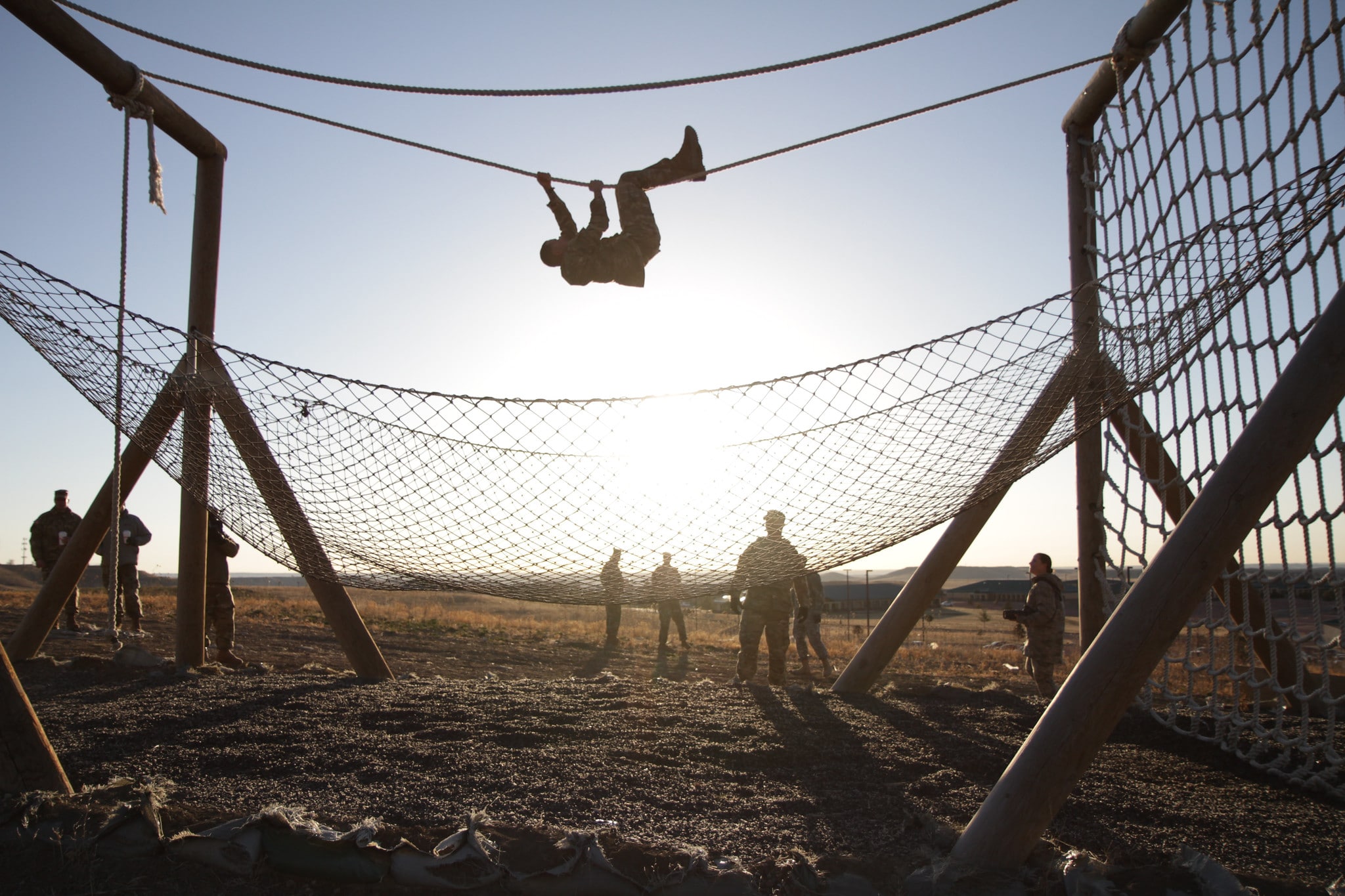 National guard member hanging from a rope