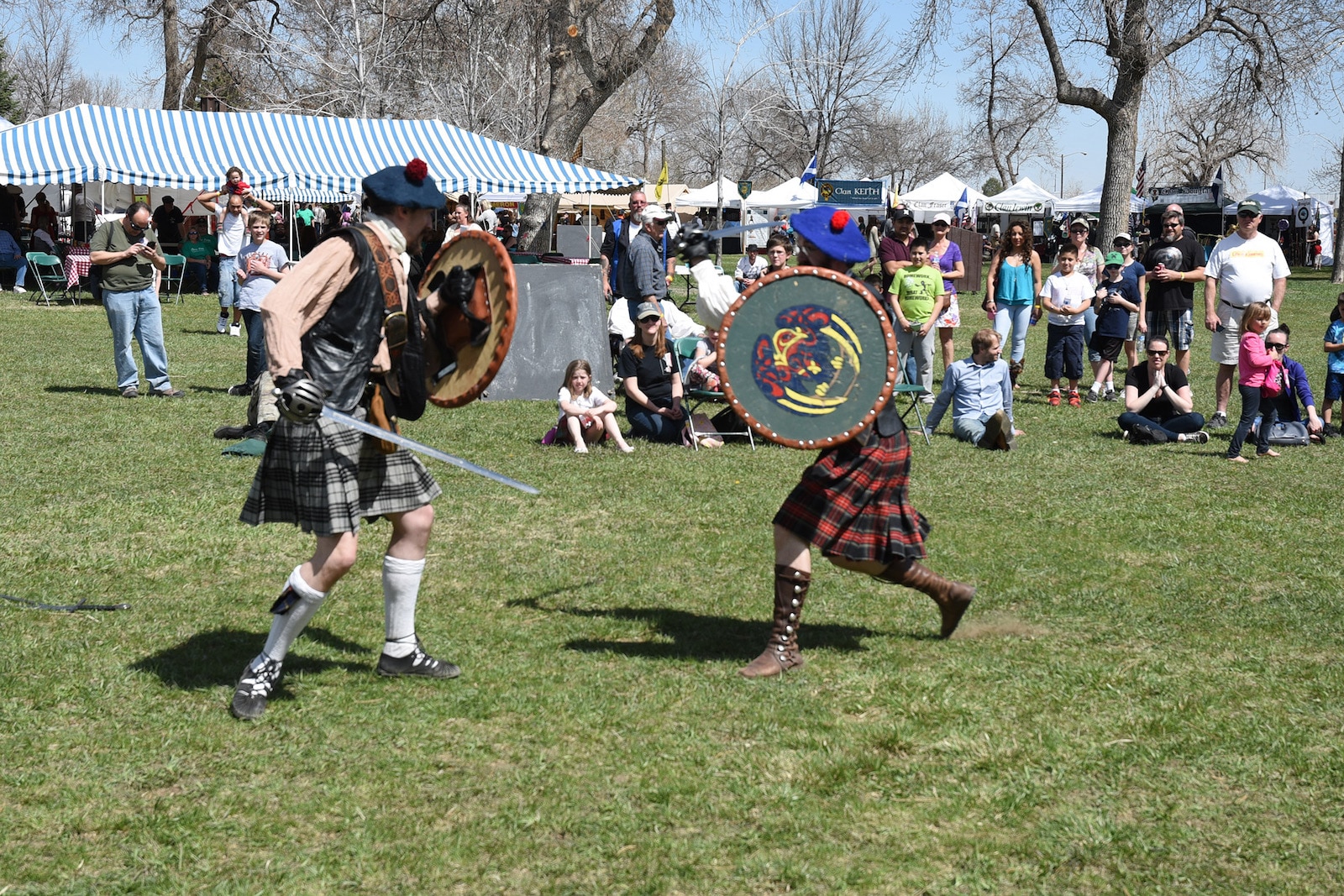 Image of people mock fighting at the Colorado Tartan Day Festival in Longmont, CO