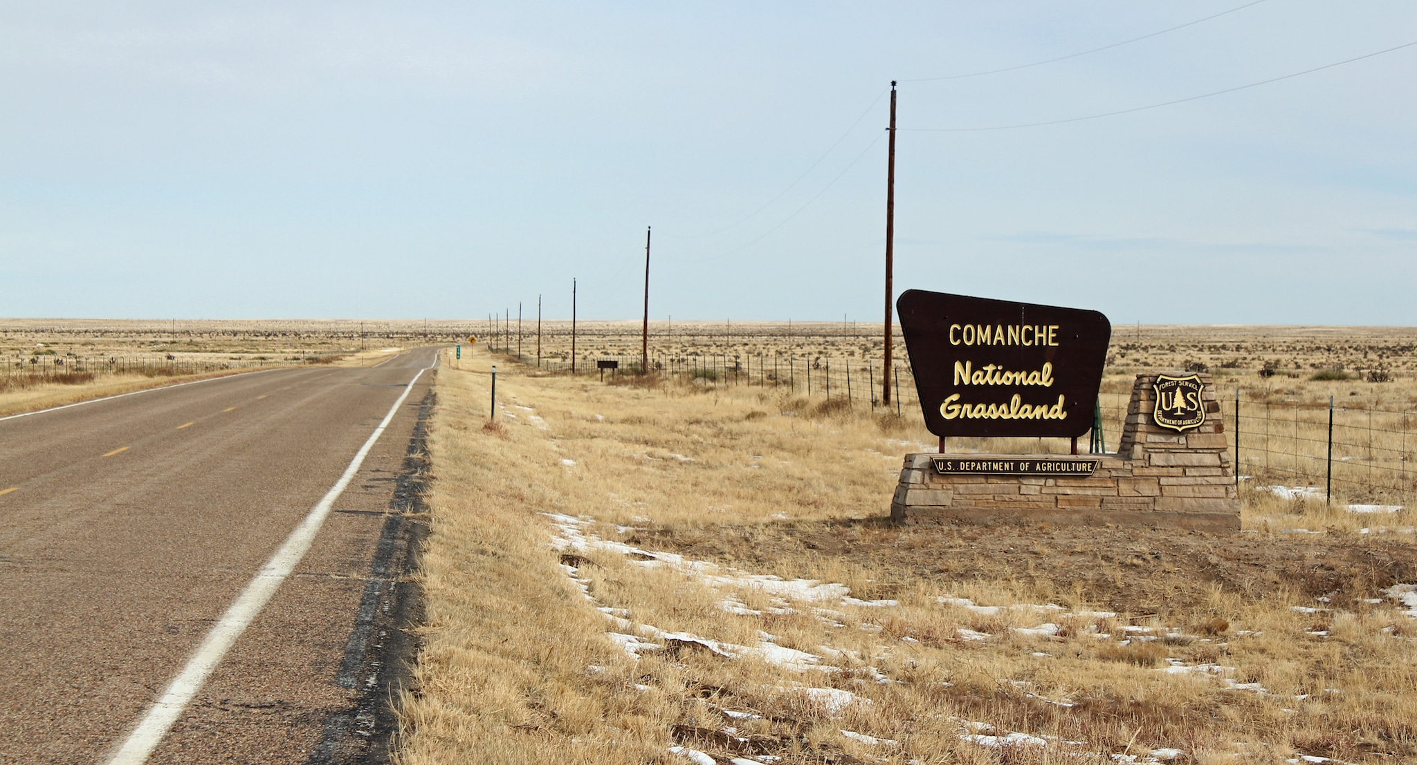 A large brown USFS sign showing Comanche National Grassland.