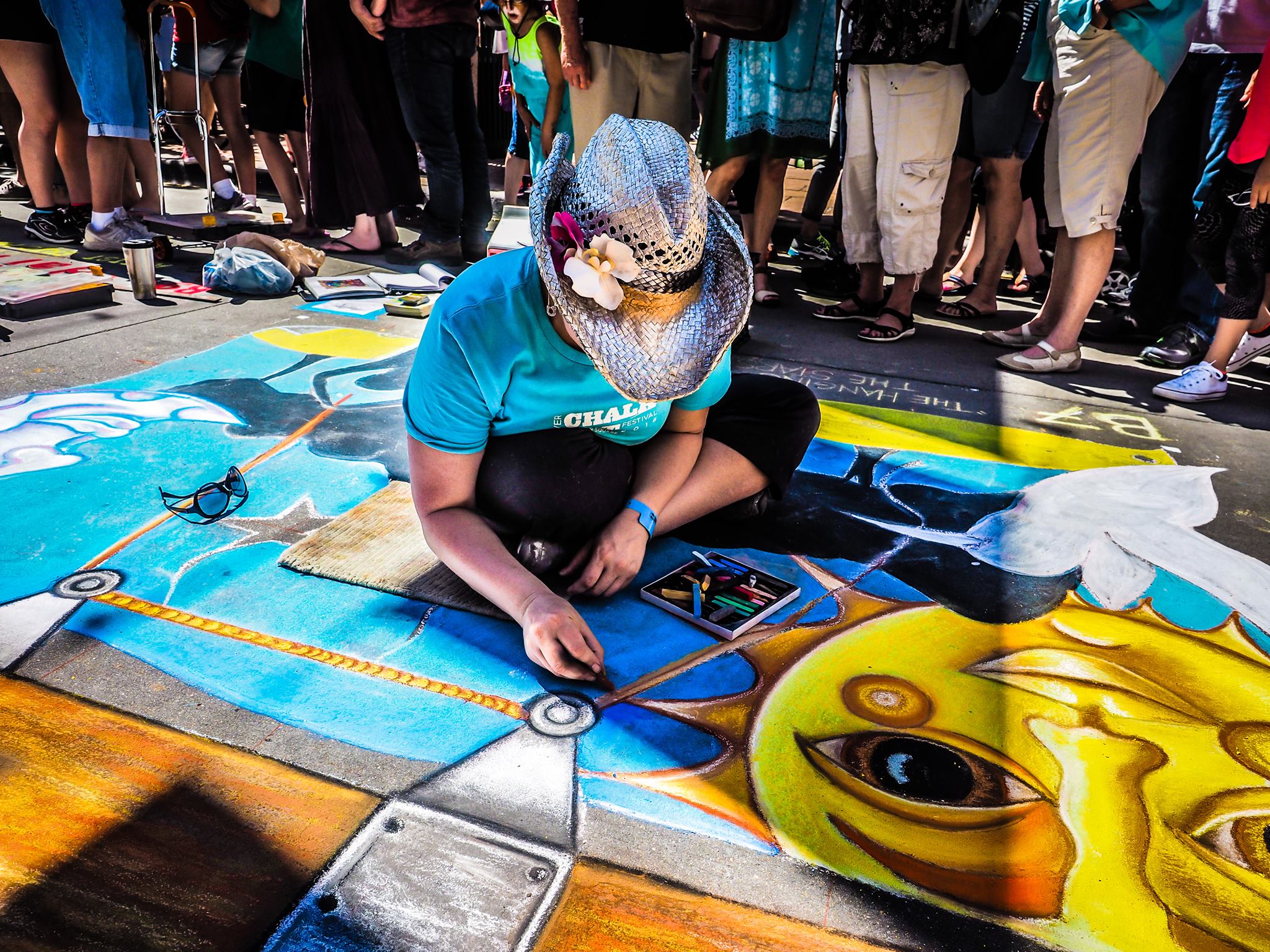 Artist creating street art with chalk