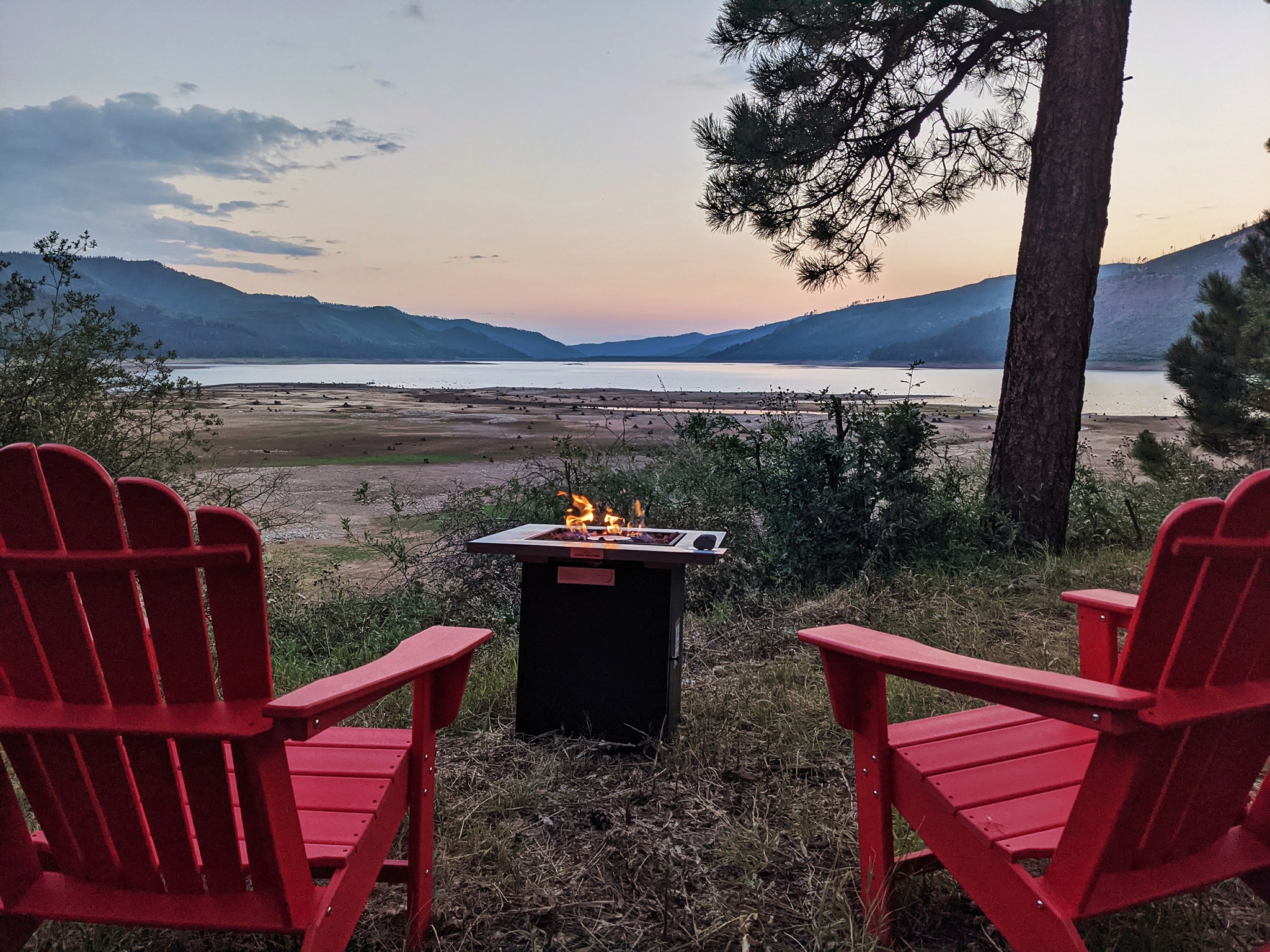 Lakefront view with an outdoor fire pit