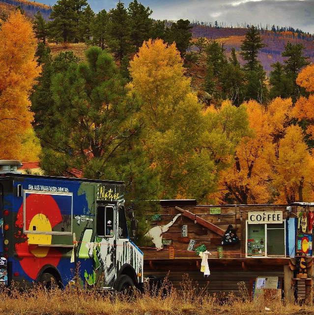 Coffee food truck against fall trees