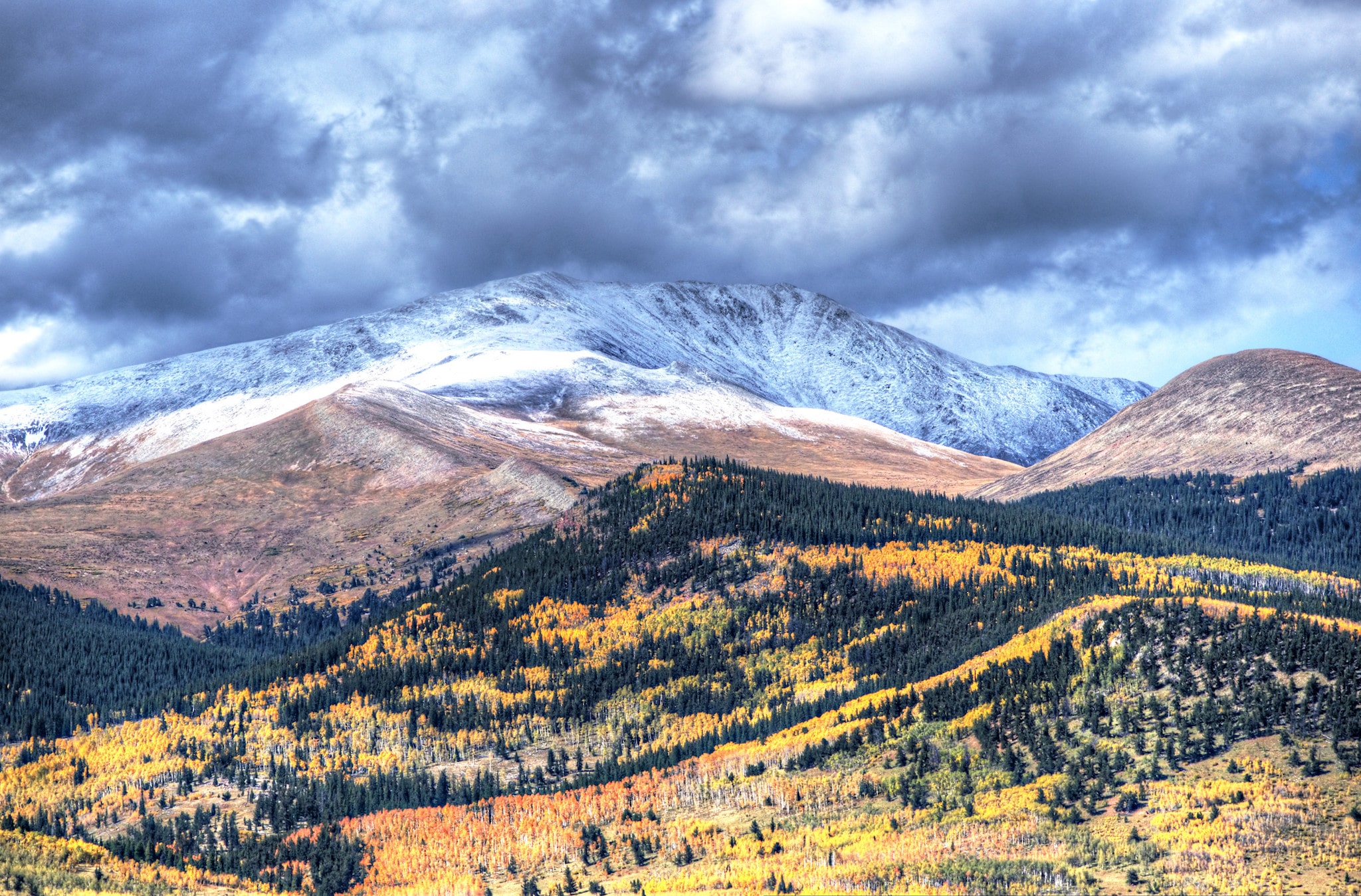 Fall foliage and a light dusting of mountain snow, seen from Kenosha Pass, Colorado.