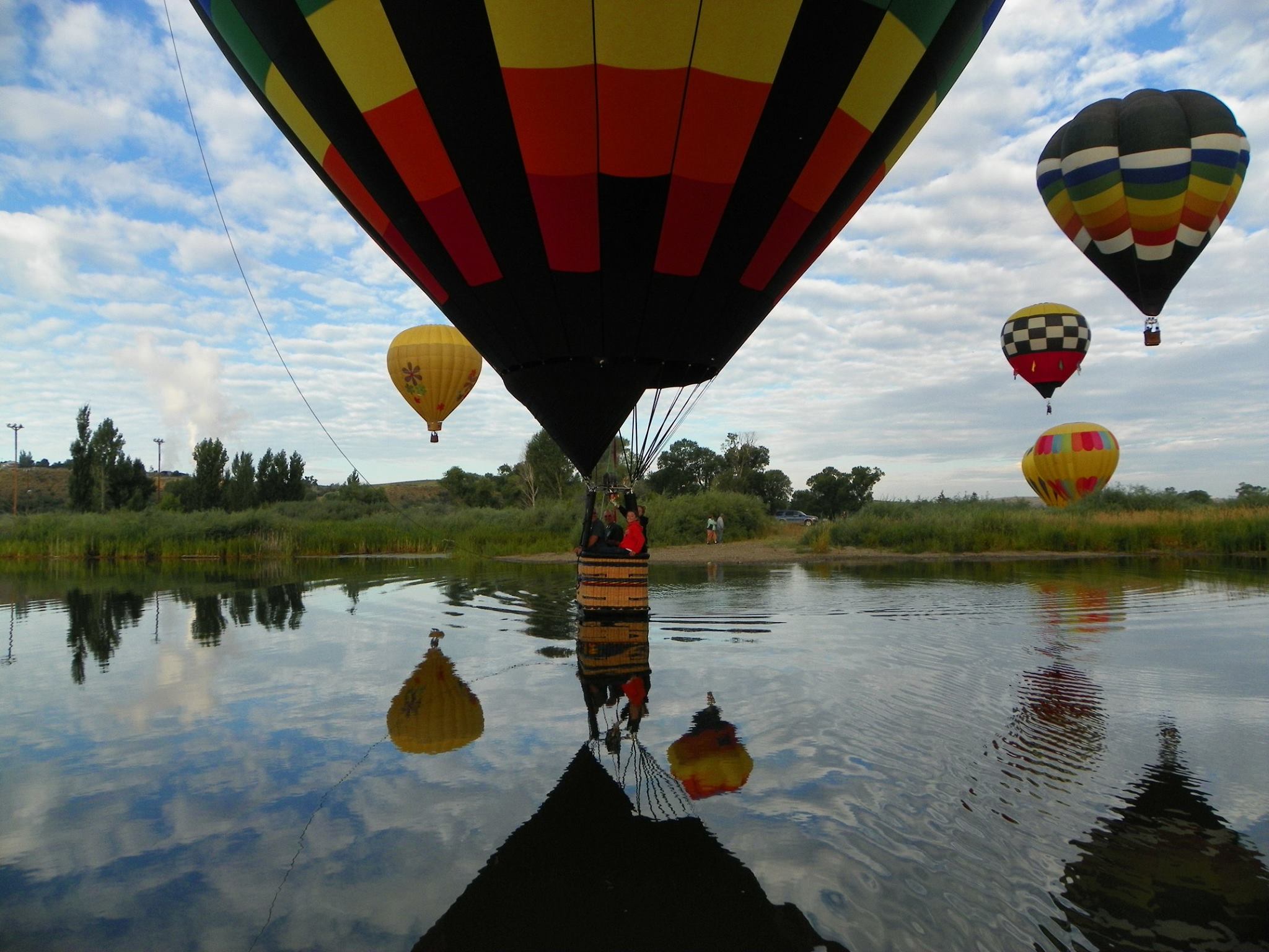 Hot air balloon over lake