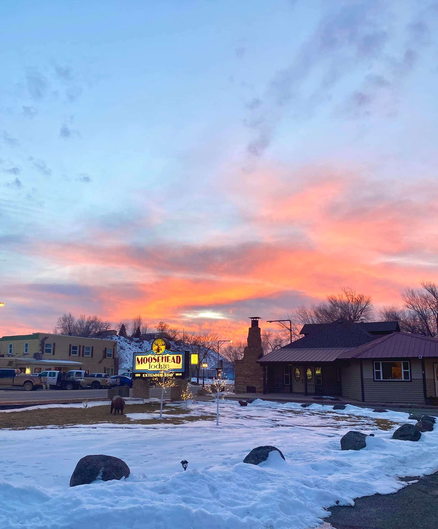 Sunset over snowy lodge