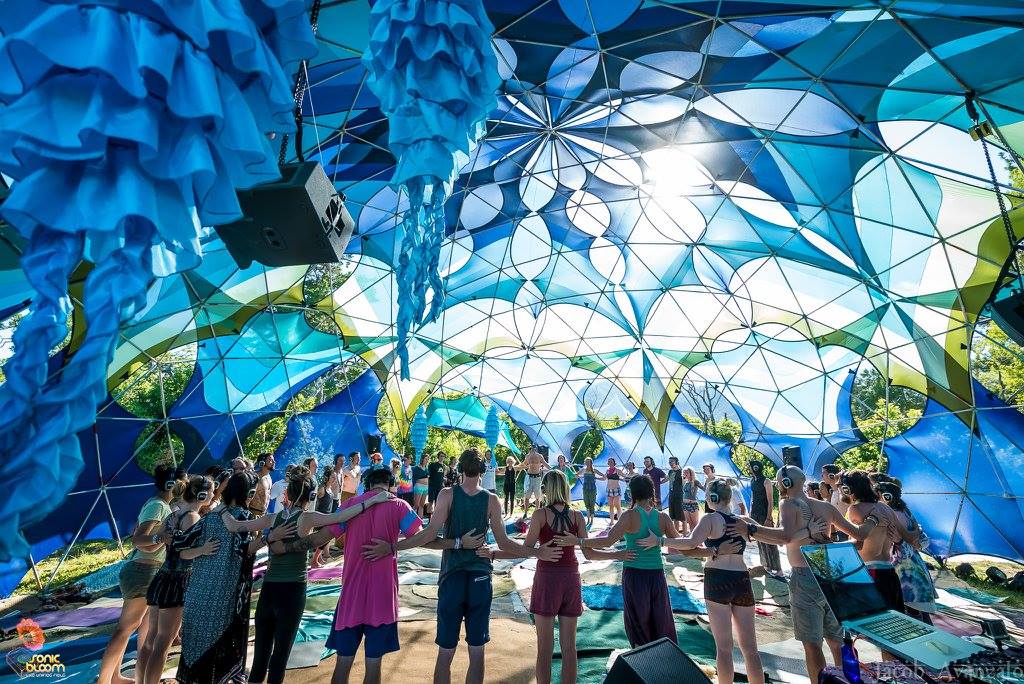 Crowd under blue art installation