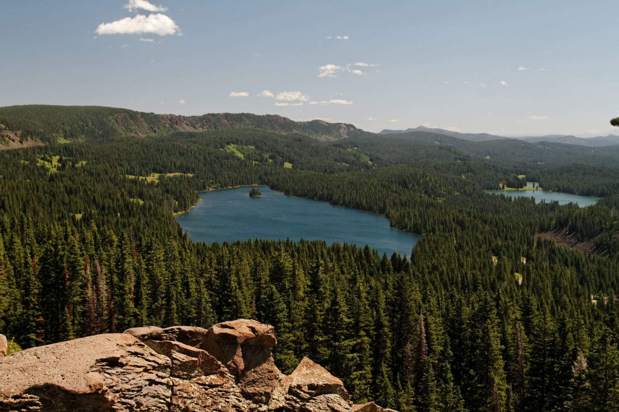 Rolling ridges and lakes a plenty amongst dense woods in Grand Mesa National Forest.