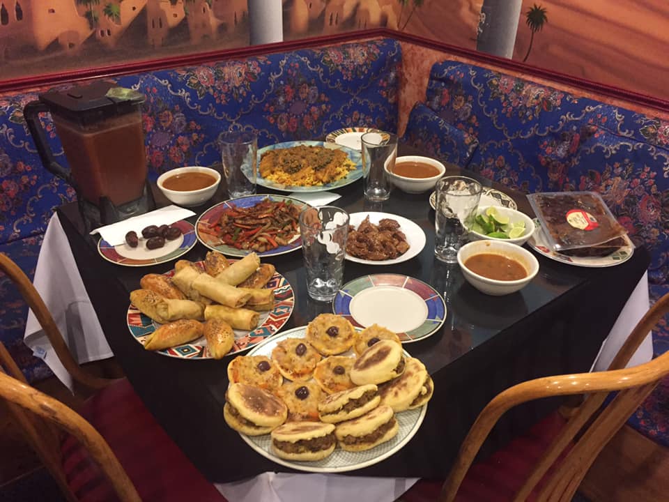 Many dishes of food on a table