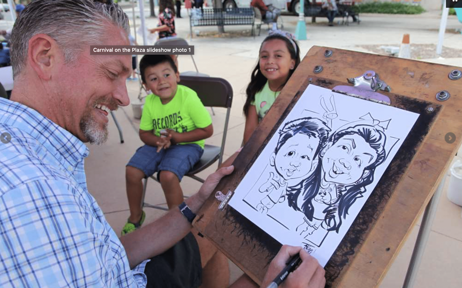 Man painting character drawings of two kids 